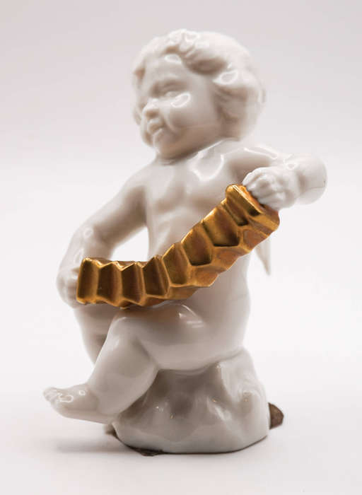 Hutschenreuther Selb LHS porcelain cherub with gilt concertina, Germany c.1950s