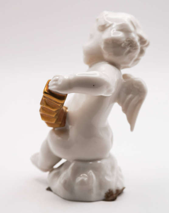 Hutschenreuther Selb LHS porcelain cherub with gilt concertina, Germany c.1950s