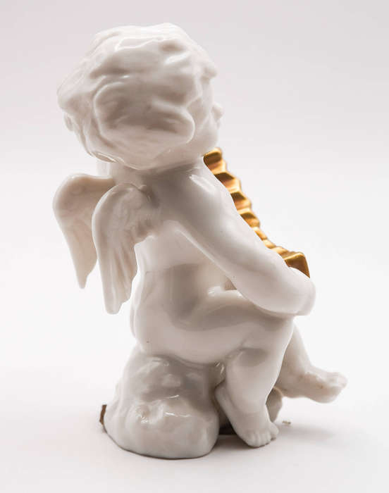 Hutschenreuther Selb LHS porcelain cherub with gilt concertina, Germany c.1950s