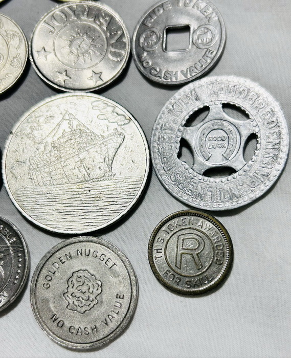 Twelve x Casino tokens all different as one lot Relict non payment.