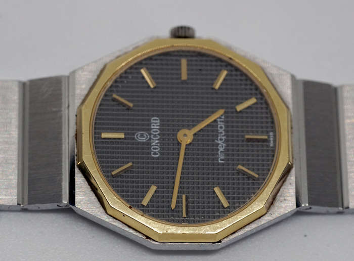 concord mariner ladies watch with solid 18K gold bezel and 18k nugget on buckle