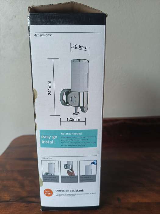 Two shampoo and soap dispensers in boxes, never been used