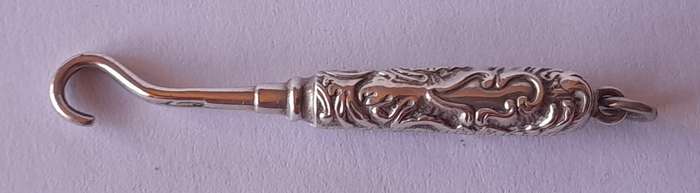 Edwardian All Solid Silver Miniature Glove Hook Pendant. Adie & Lovekin, Birmingham.