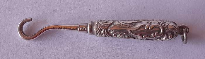 Edwardian All Solid Silver Miniature Glove Hook Pendant. Adie & Lovekin, Birmingham.