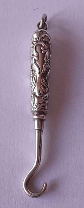 Edwardian All Solid Silver Miniature Glove Hook Pendant. Adie & Lovekin, Birmingham.