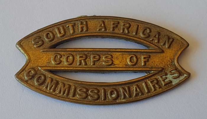 Rare SA Corps of Commissionaires Cap Badge.  No Lugs.