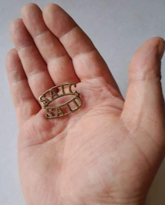 Early SA Army Instructional Corp Brass Shoulder Title.  Lugs Intact.