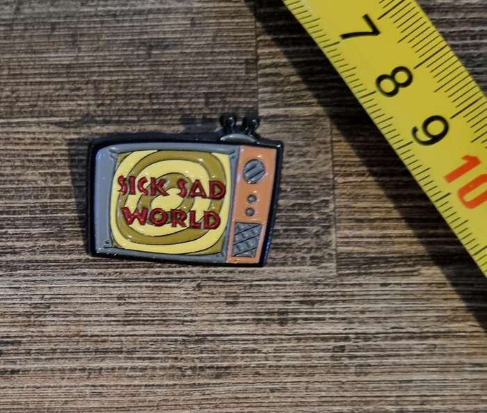 Sick Sad World Enamel Pin