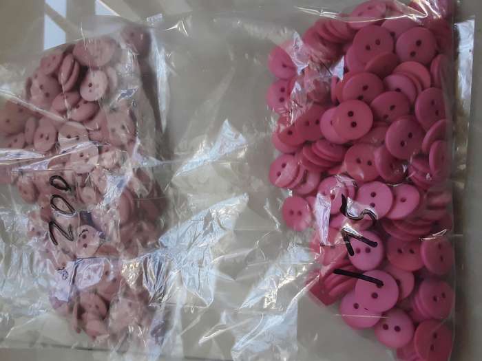 Buttons-- 2200 assorted plastic buttons.
