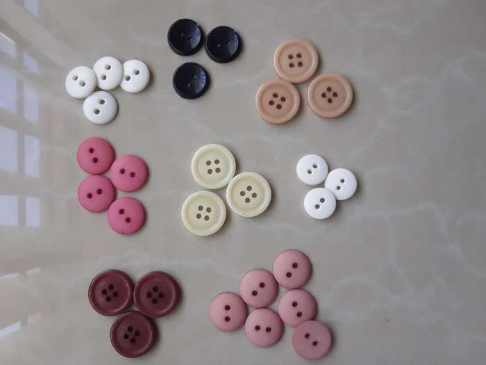 Buttons-- 2200 assorted plastic buttons.