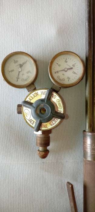 Harris Oxy-acetylene cutting torch with regulator and gauges.