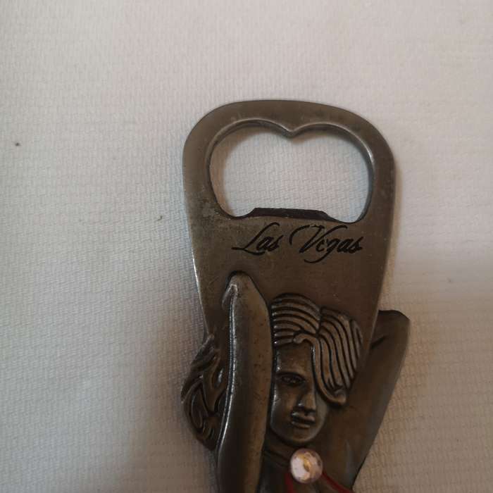 Rare 1980s Las Vegas 9 bottle opener. Beautiful Women cut out.