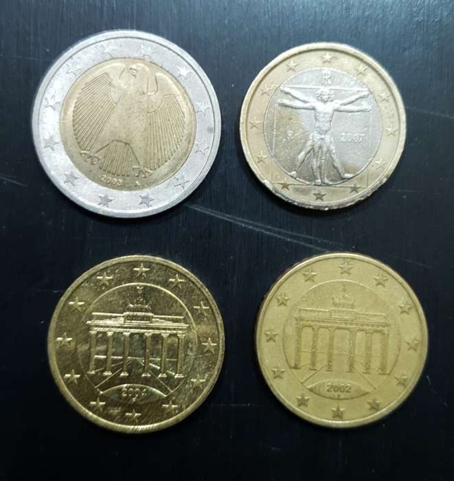 Collection of 4 Euro coins totalling 4 Euro.