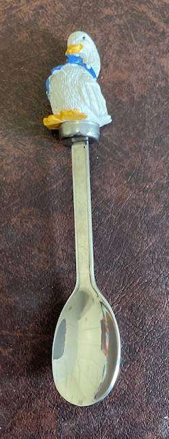 Children's teaspoon with Jemima Puddleduck inspired figurine on top.