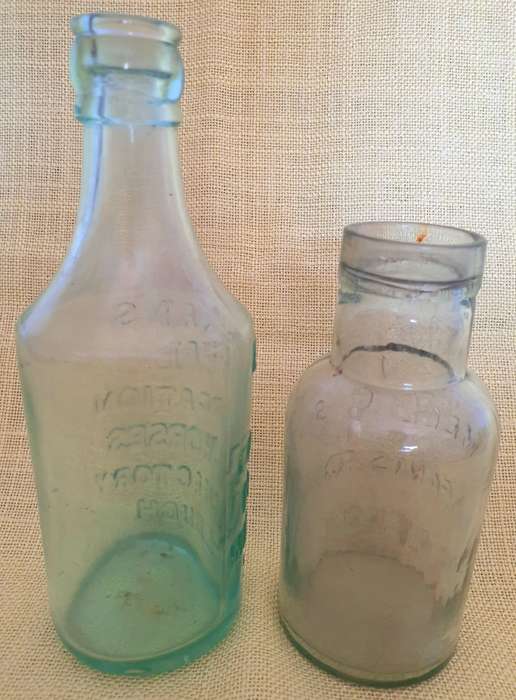 2 x Antique embossed bottles
