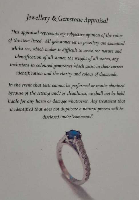 18 carat white gold diamond and blue sapphire ring