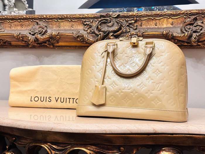 Louis Vuitton Iconic Alma Monogram Signature Collection Handbag