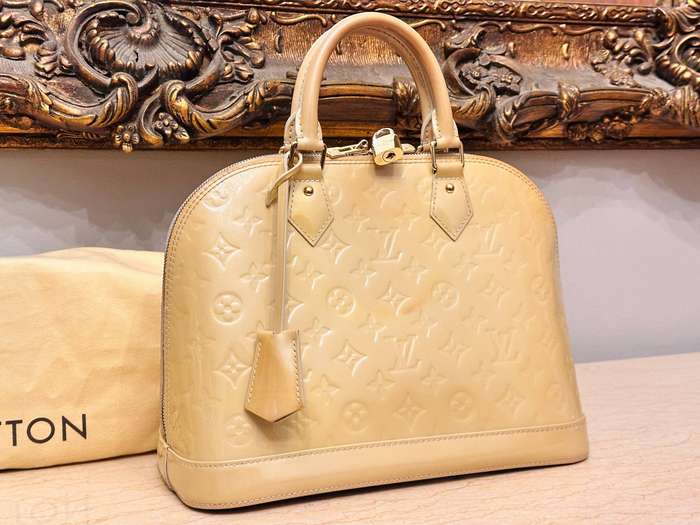 Louis Vuitton Iconic Alma Monogram Signature Collection Handbag