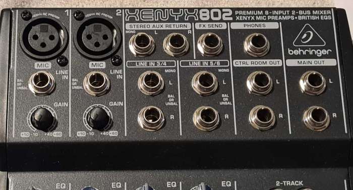Behringer Xenyx 802 audio mixer. It's a compact, 8-input mixer.