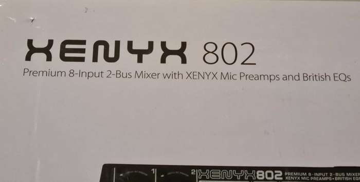Behringer Xenyx 802 audio mixer. It's a compact, 8-input mixer.