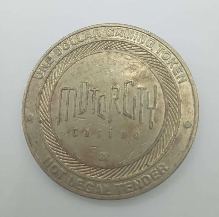 ONE DOLLAR GAMING TOKEN - MOTOR CITY- DETROIT MICHIGAN- NOT LEGAL TENDER