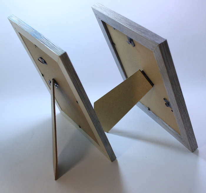 Two Pale Pastel Coloured Photo Frames With Stands