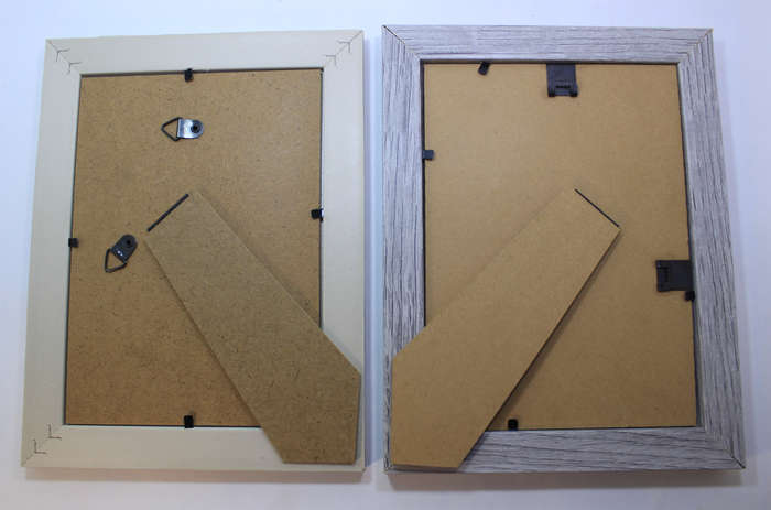 Two Pale Pastel Coloured Photo Frames With Stands