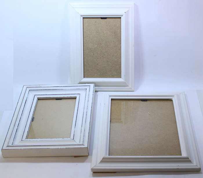 Three Various Sized White Photo Frames With Stands