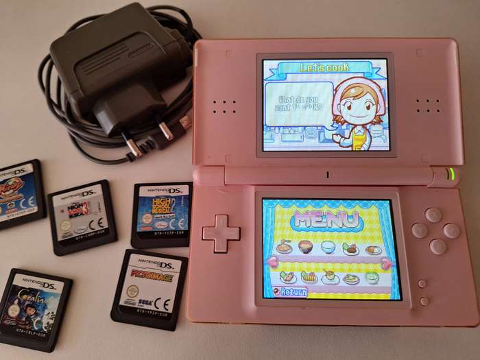 Nintendo DS Lite (pink) + charger + 6 games.