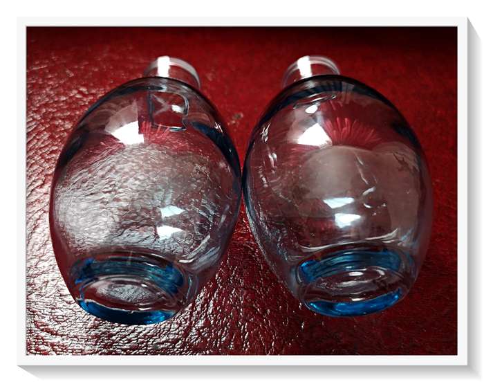 A Pair of clear blue glass bottles - Dimensions: 12cm by 7cm - Condition: New