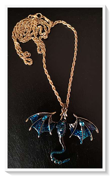 A Whimsical Deep Blue Dragon Necklace Metal Pendant with Simulated Blue Diamante and Enamel Coating