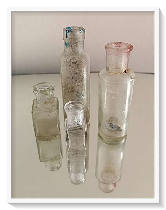 Four Old Clear Glass Yesteryear Bottles - Two Front Bottles are Tiny but Thick Glass