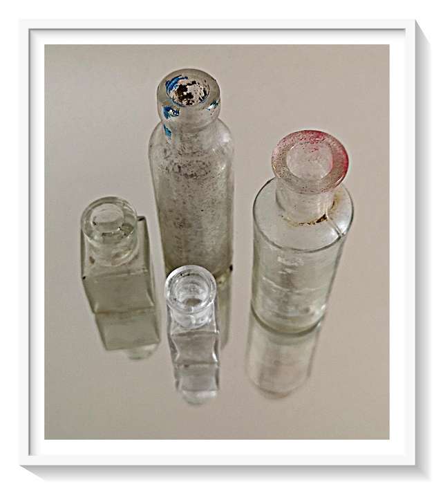 Four Old Clear Glass Yesteryear Bottles - Two Front Bottles are Tiny but Thick Glass
