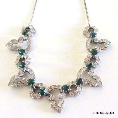 A vintage costume jewellery necklace With green and clear stones
