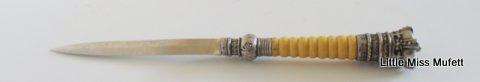 An Antique magnifier and letter opener