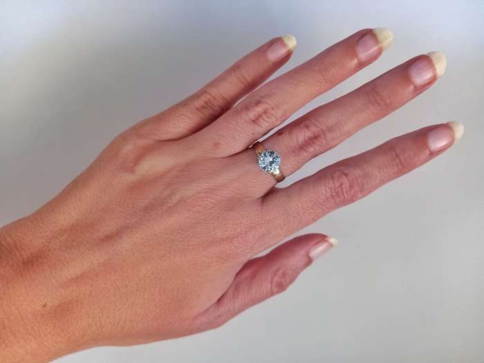 Classic vintage 9ct gold ring set with a round faceted blue topaz