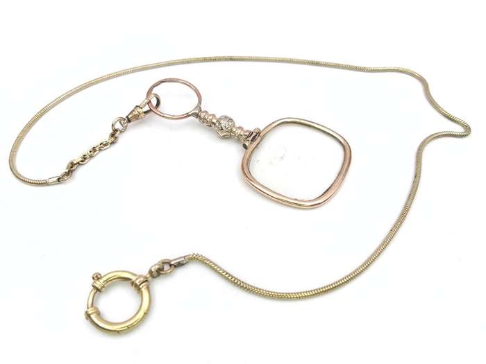 Antique gold plated quizzing glass on chain