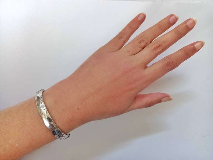 Vintage sterling silver faceted engraved bangle