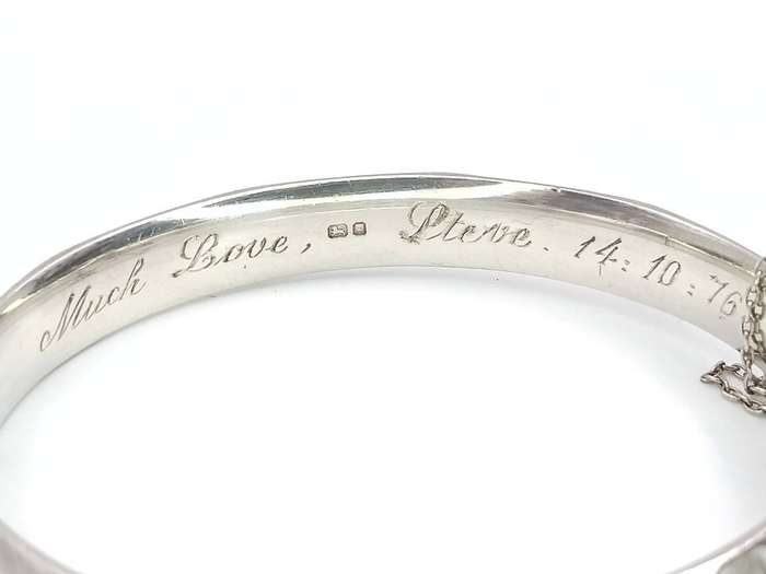 Vintage sterling silver faceted engraved bangle