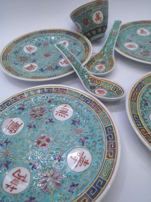 Collection of oriental plates and spoons
