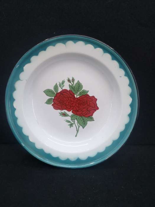 Old enamel plate with rose detail