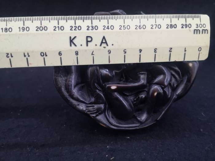 Buddha with Kama Sutra scene at the bottom