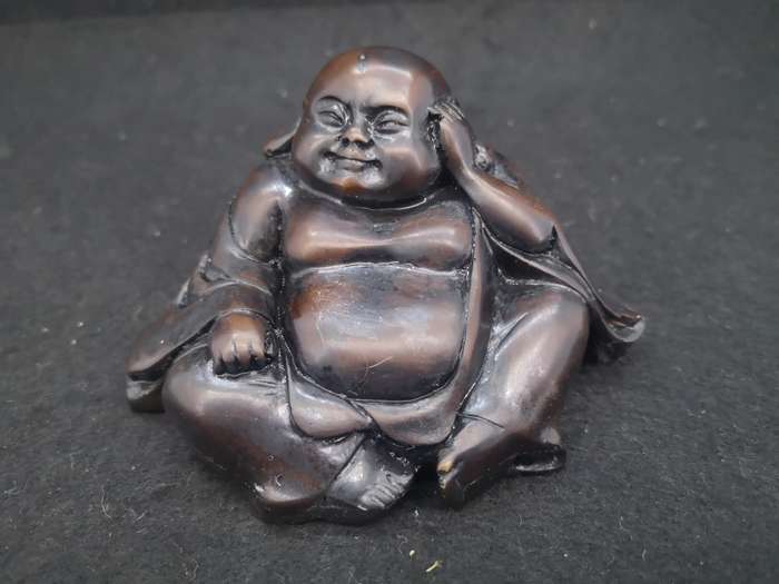 Buddha with Kama Sutra scene at the bottom