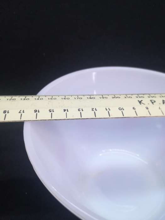 Vintage milk glass mixing bowl with red detail