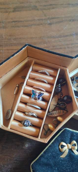 Lot of costume jewelry in octagonal jewelry box
