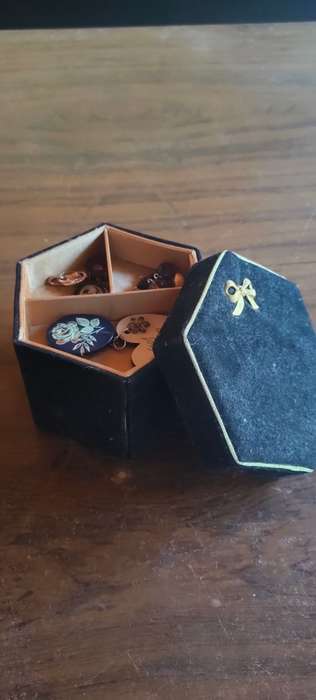 Lot of costume jewelry in octagonal jewelry box