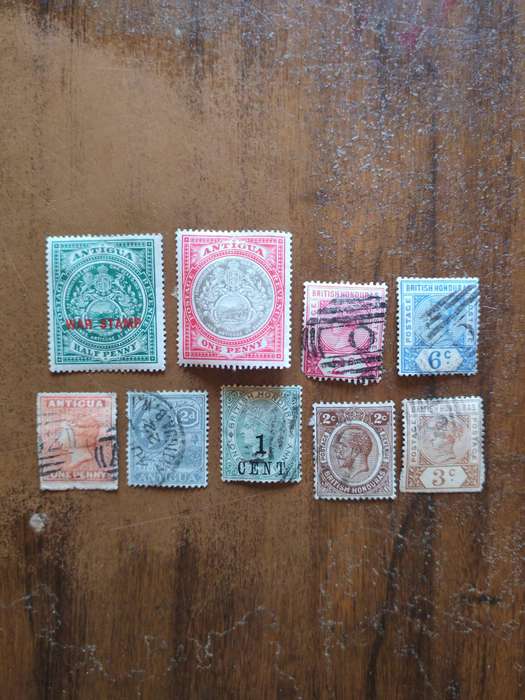 A collection of vintage Antigua and British Honduras stamps