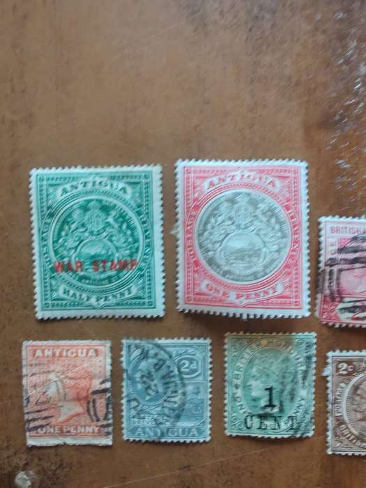 A collection of vintage Antigua and British Honduras stamps
