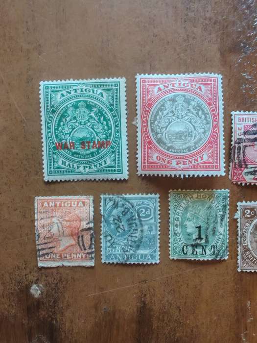 A collection of vintage Antigua and British Honduras stamps