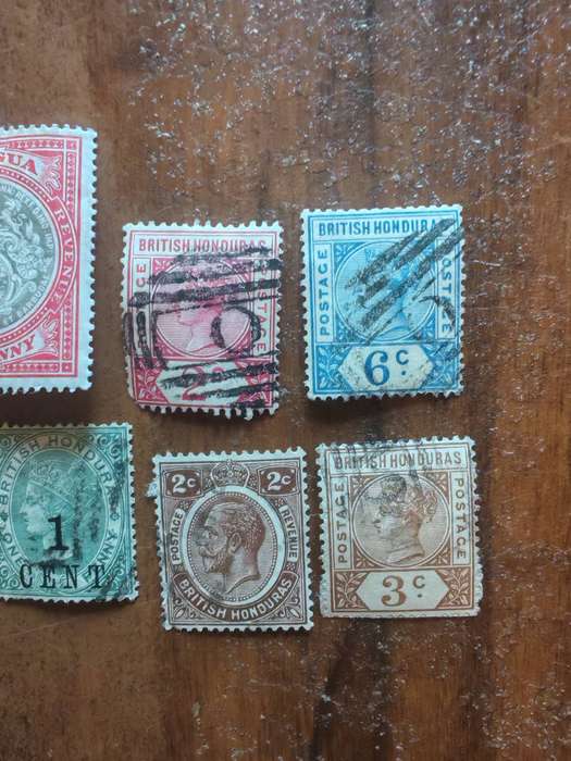 A collection of vintage Antigua and British Honduras stamps